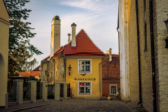 Photo by Unsplash An illustrative photo of a yellow house near stone buildings.
