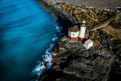 Photo by Unsplash An illustrative photo of a white lighthouse beside a body of water.