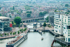 An illustrative photo of a river running through a city.
