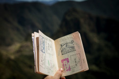 An illustrative photo of a group of a person holding passport.