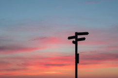 road sign at sunset