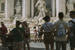 People walking next to Di Trevi Fountain in Rome