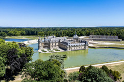 A castle on a hill by a river