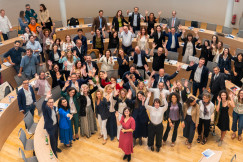 Crowd greeting the camera at the Ferrero Auditorium at SDA Bocconi