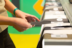 Pair of hands touching fabric