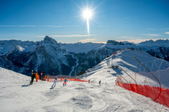 a-group-of-people-riding-skis-on-top-of-a-snow-covered-slope