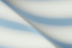 white and light blue synthetic textile, close up