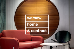 Interior scene with modern furniture and the text “Warsaw Home & Contract” displayed on a circular backdrop.