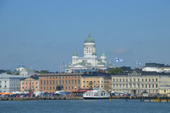 white-and-brown-concrete-building-near-body-of-water-during-daytime