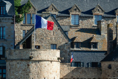 french-flag-waves-proudly-over-the-stone-buildings