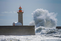a-lighthouse-surrounded-by-waves-in-the-ocean