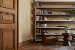 Books on Shelves behind Chair 