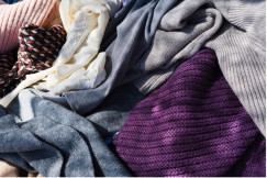 Various types of clothing gathered in an untidy manner