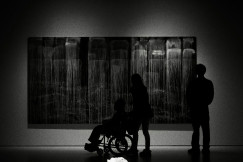silhouettes-of-people-viewing-abstract-art-in-a-gallery