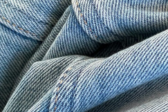 close-up photo of light blue denim fabric