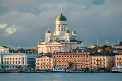 white-concrete-mosque-near-body-of-water