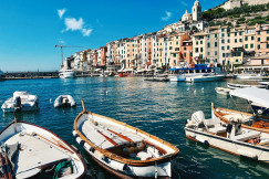 white-motor-boat-parked-on-sea-