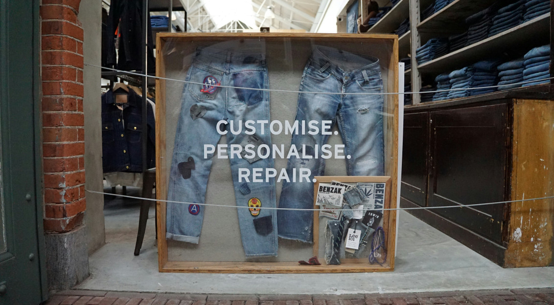 frame containing jeans with patches 