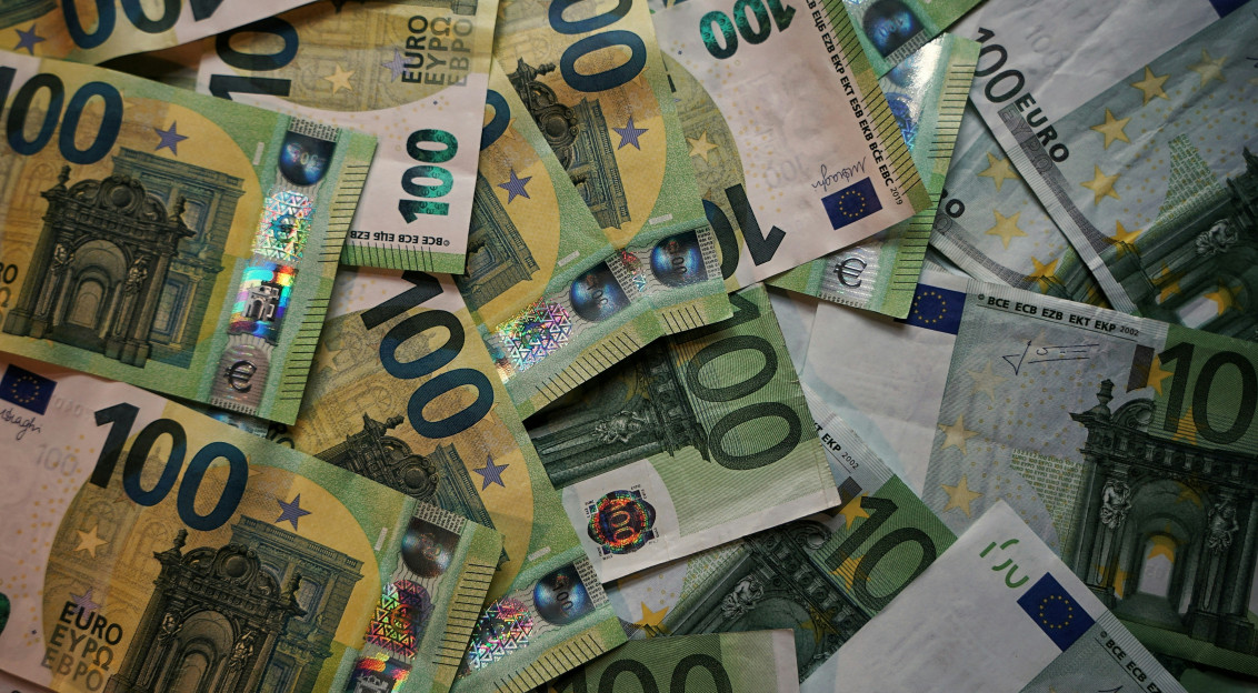 A pile of Euro (EUR) banknotes that include 100 notes. 