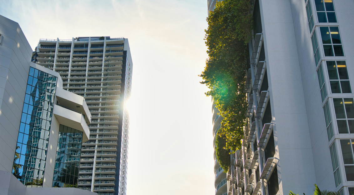 The picture showcases a modern urban buildings featuring integrated greenery and contemporary architecture.