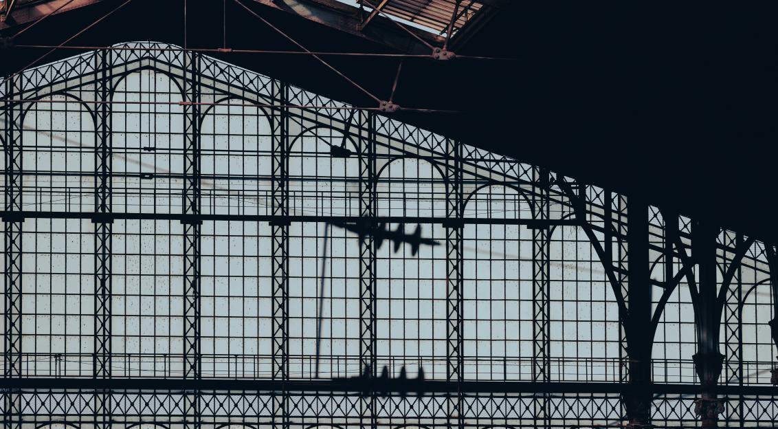 Photo by Unsplash An illustrative photo of a train station with a train on the tracks