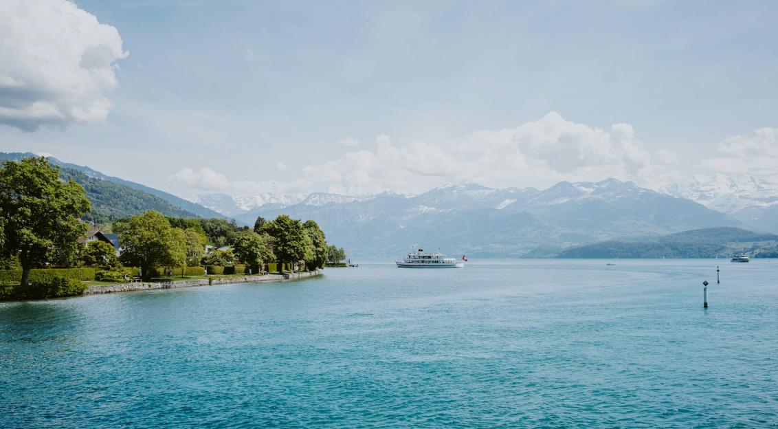 Photo by Unsplash An illustrative photo of a body of water with a boat.