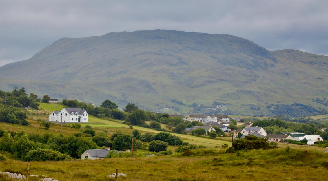 An illustrative photo of houses in the mountains