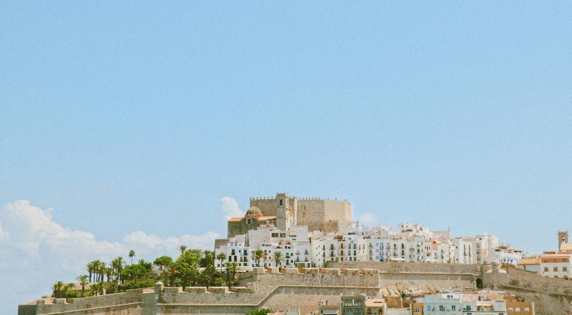 Photo by Unsplash An illustrative photo of city buildings under blue sky.