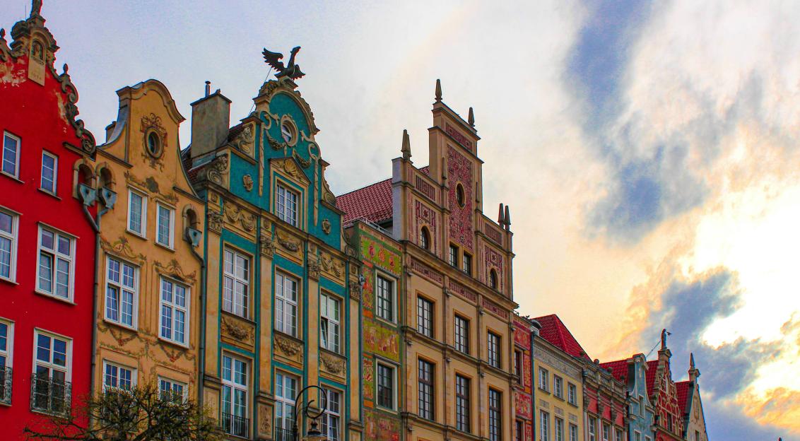 An illustrative photo of a row of buildings of different colours in Gdansk