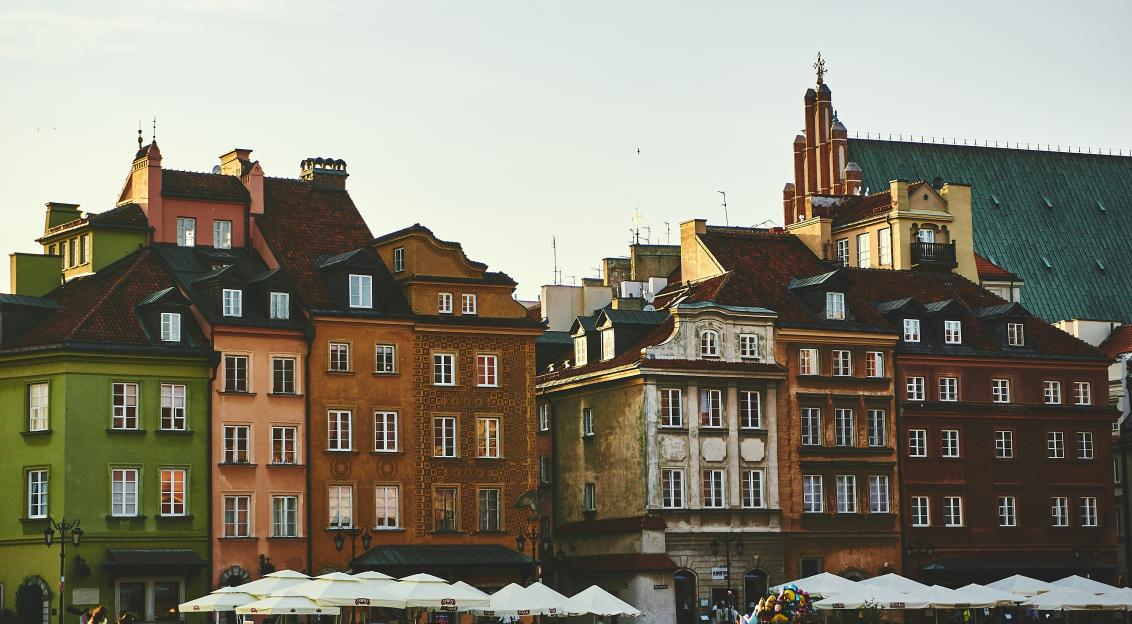 Photo by Unsplash An illustrative photo of a group of people on street near the brown concrete building