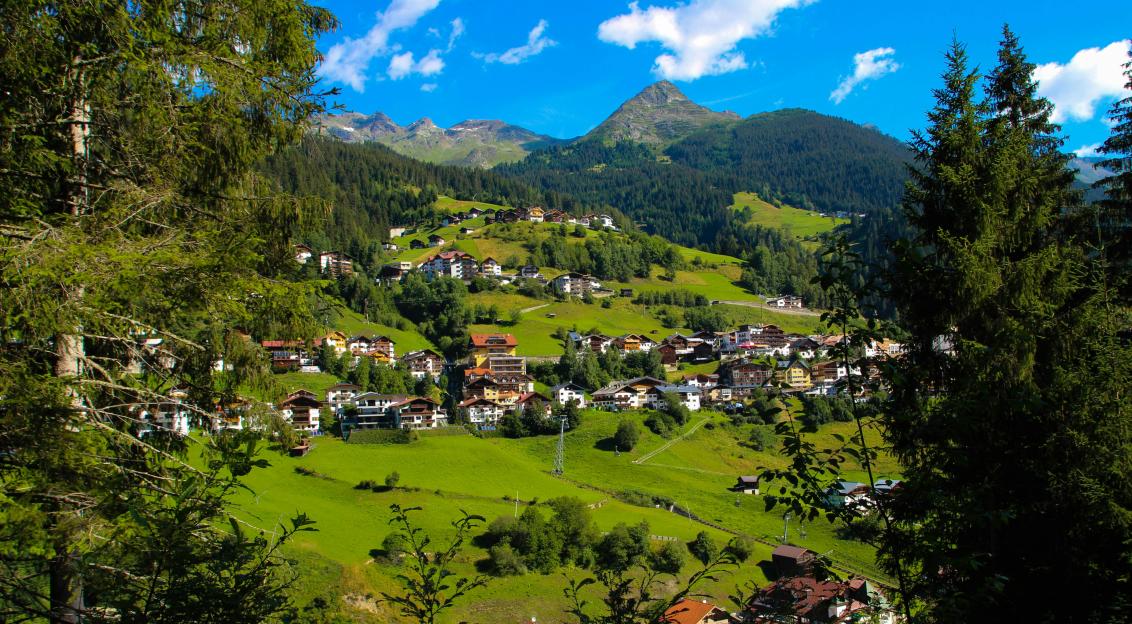Photo by Unsplash An illustrative photo of houses in green mountain.