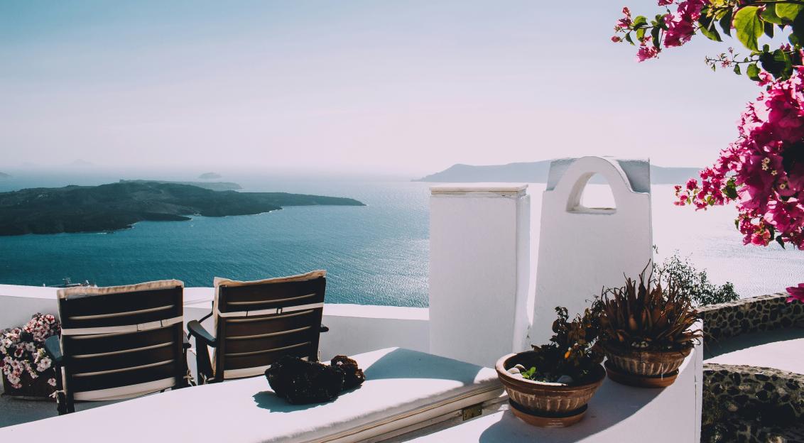 Photo by Unsplash An illustrative photo of two brown wooden chairs beside the wall.