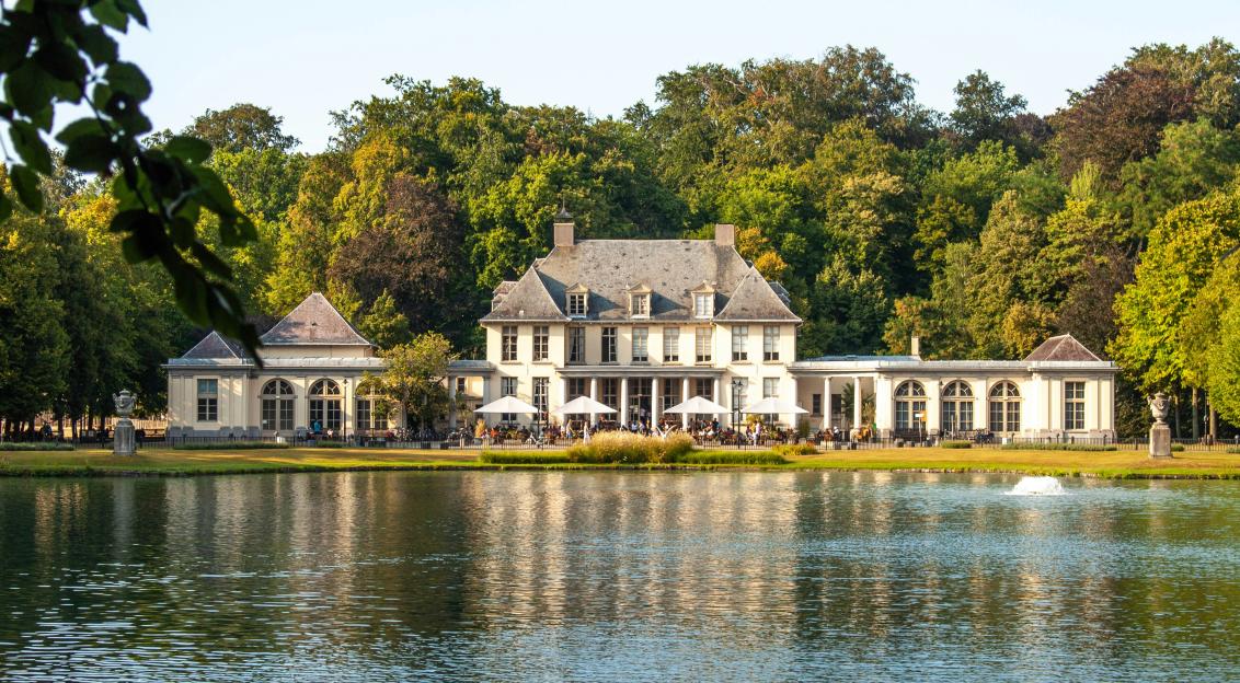 An illustrative photo of a house near the water.