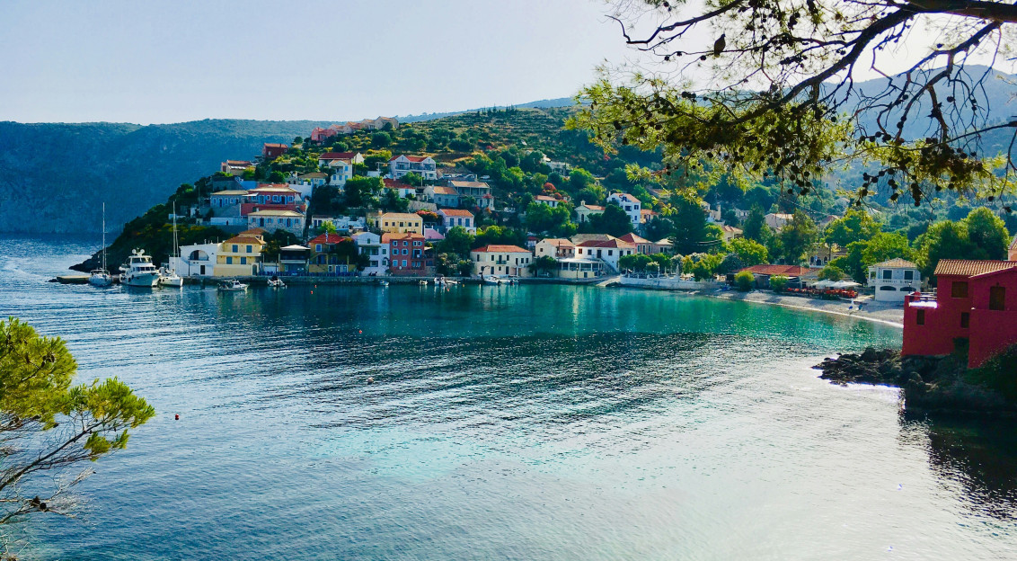 Photo by Unsplash An illustrative photo of houses on a hill near a body of water