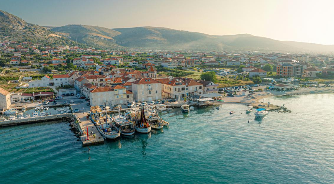 Photo by Unsplash An illustrative photo of a harbor with boats in the water.