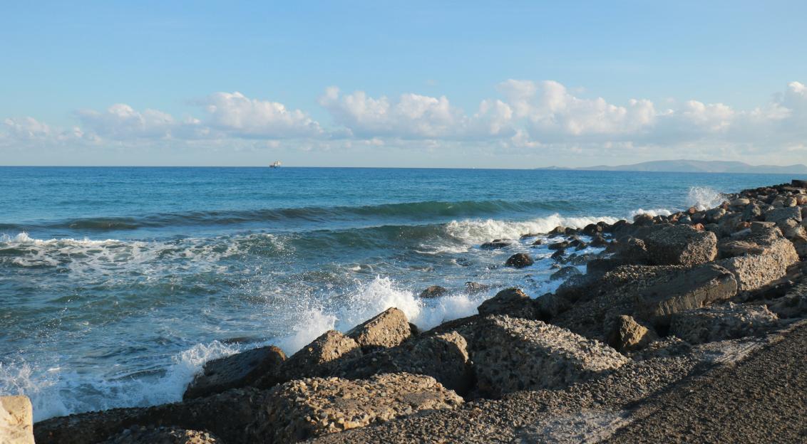Photo by Unsplash An illustrative photo of a view of the sea from a rocky shore.
