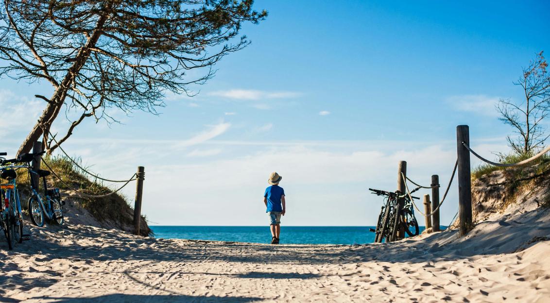 Photo by Unsplash An illustrative photo of a person standing on a beach.