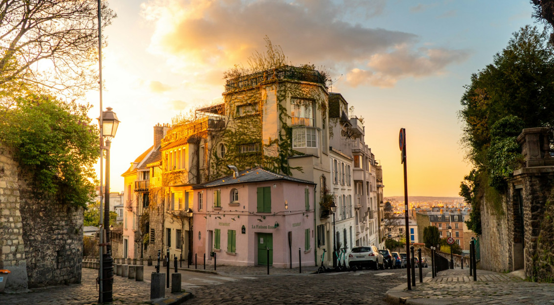 An illustrative photo of a white and brown concrete building.