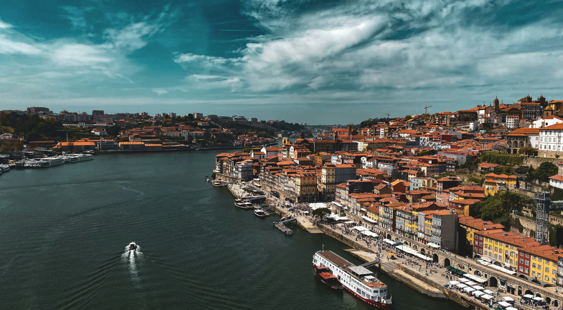Photo by Unsplash An illustrative photo of a boat floating next to the city