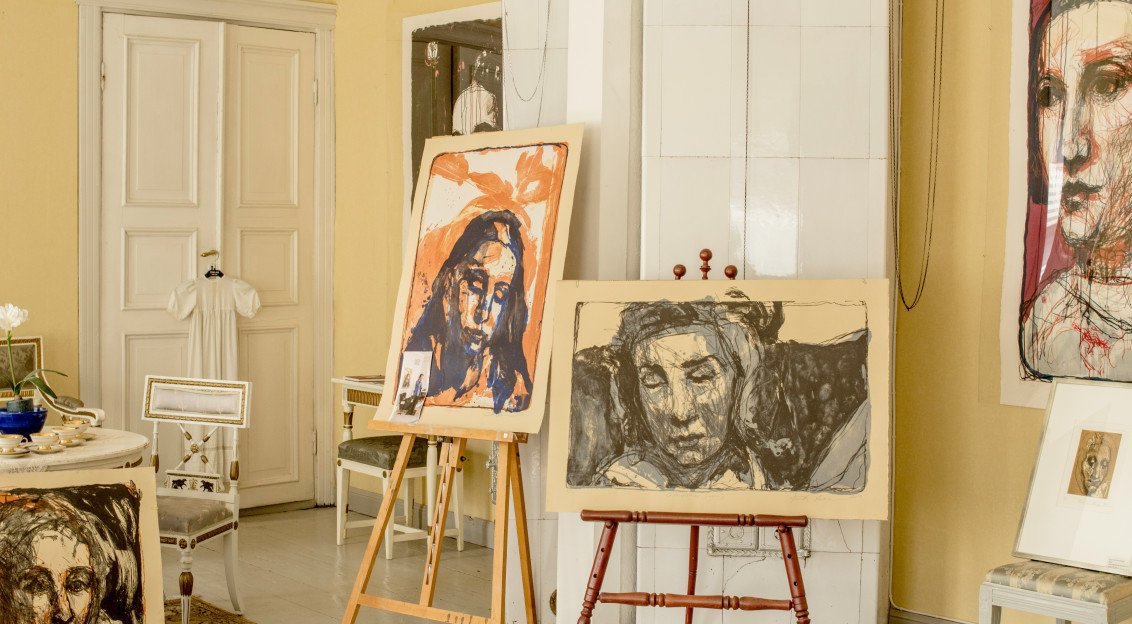 An illustrative photo of white wooden door near white wooden table