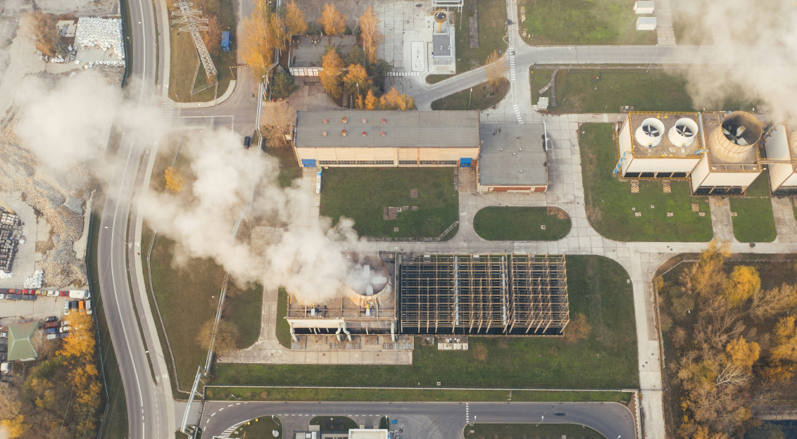 An illustrative photo of factories with a lot of smoke