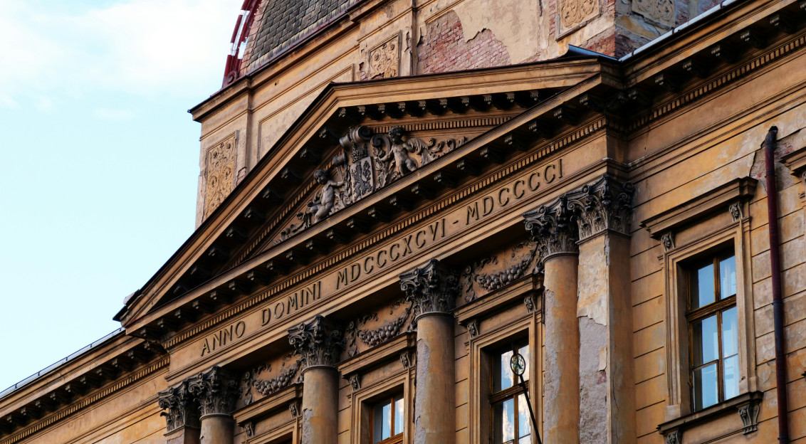 An illustrative photo of a building with sculptures on it