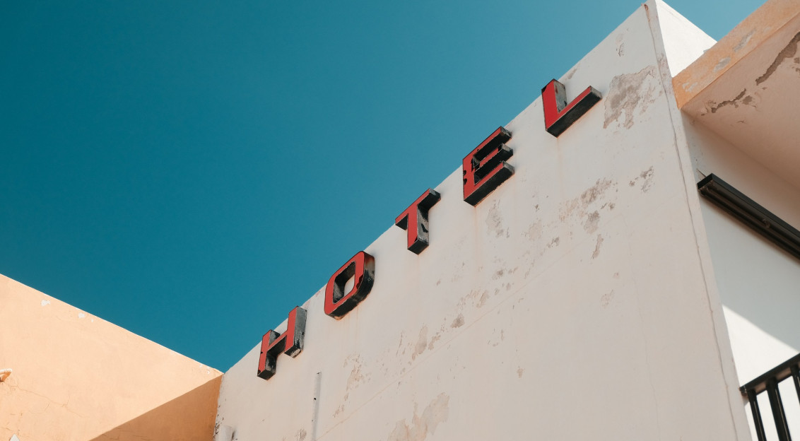 An illustrative photo of a building with a- ed sign on it.