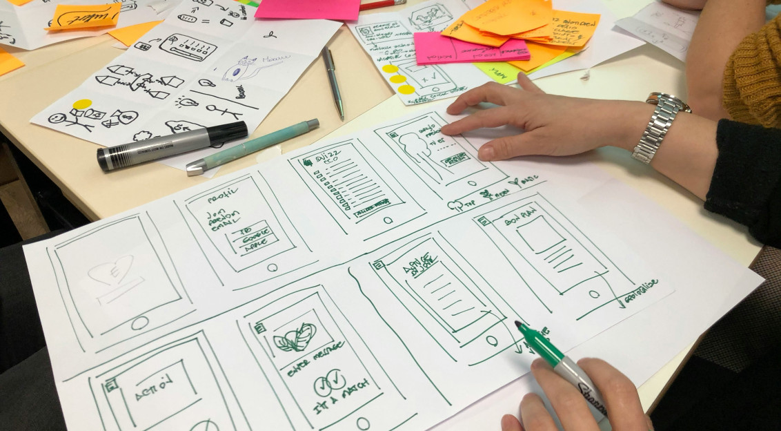 An illustrative photo of a person writing on paper
