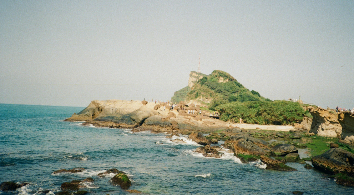 Photo by Unsplash An illustrative photo of a rocky shore with a small island.