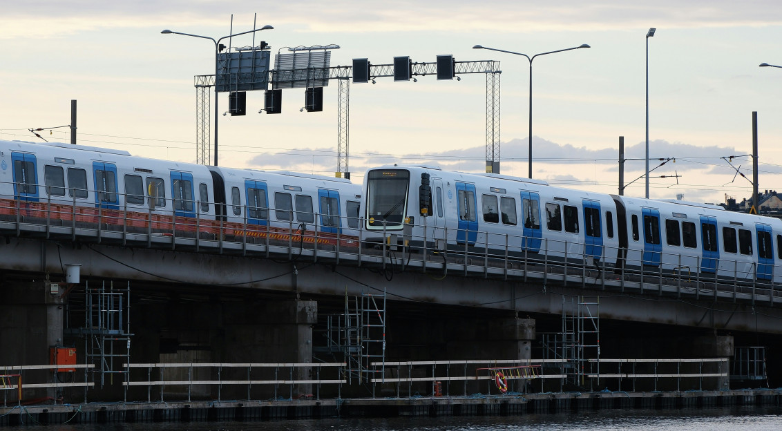 An illustrative photo of trains going on a bridge
