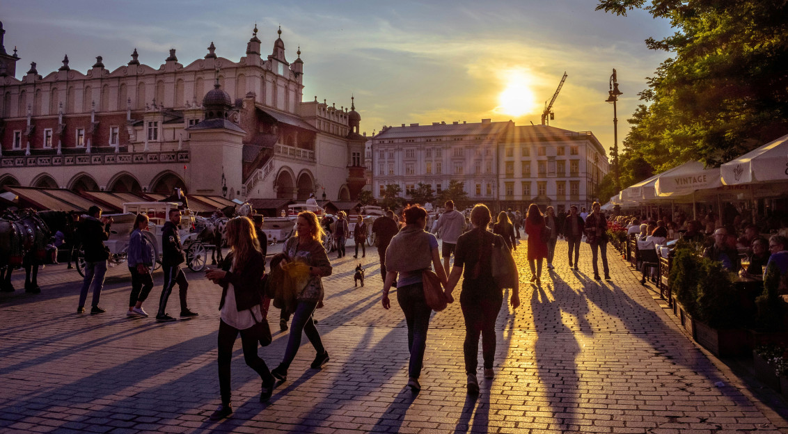 Photo by Unsplash An illustrative photo of people walking on a square during sunny weather