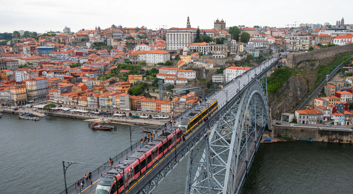 Photo by Unsplash An illustrative photo of a train crossing a bridge over a river