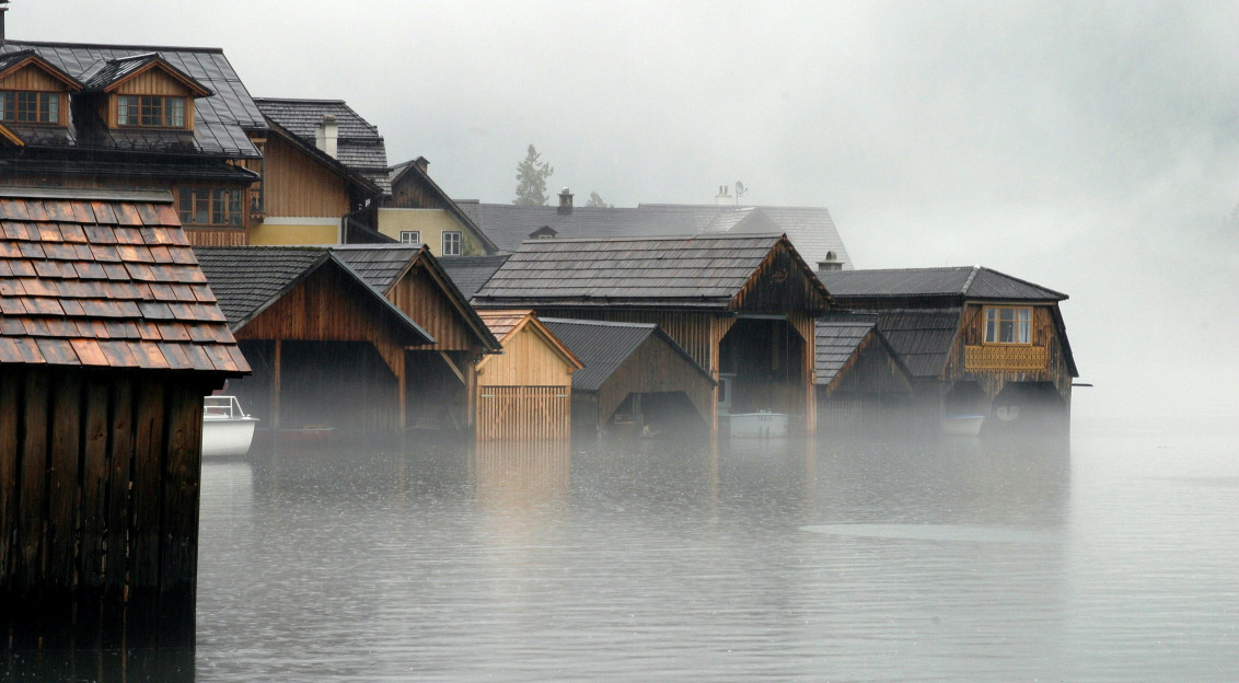 Image by Unsplash An illustrative photo of wooden houses in water.