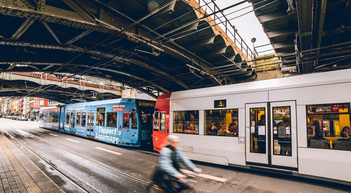 Image by Unsplash An illustrative photo of a train traveling under a bridge.